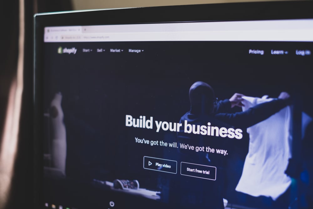 Shopify platform displayed on a laptop screen Shopify platform displayed on a laptop screen