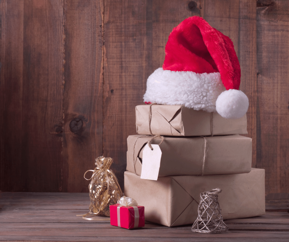 Gifts Wrrapped in Brown Paper with Santa Hat on Top - Smart Warehousing